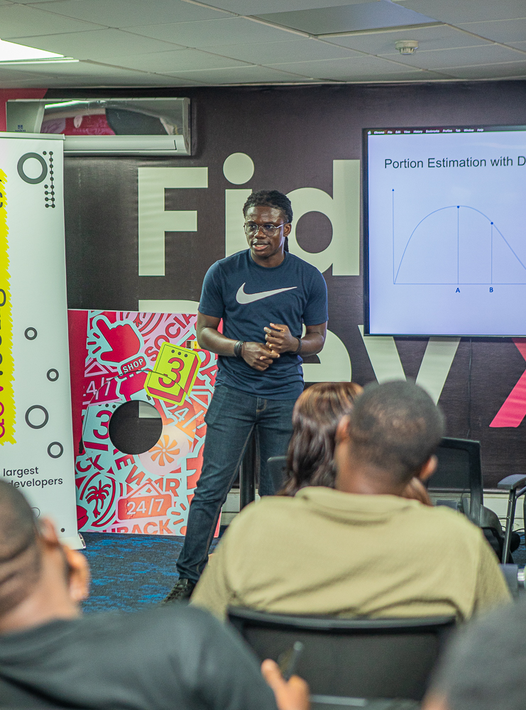 A speaker presenting to an audience at a past DevCongress event